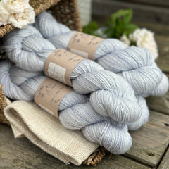 five skeins of hand dyed yarn in a light ice blue colour