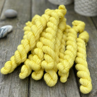 Yellow mini skeins of yarn