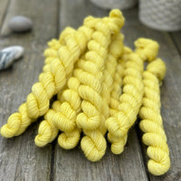 Yellow mini skeins of yarn