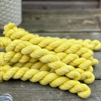 Yellow mini skeins of yarn