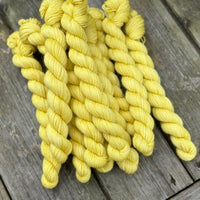 Yellow mini skeins of yarn