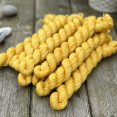 Rich yellow mini skeins of yarn