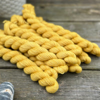 Rich yellow mini skeins of yarn