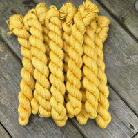 Rich yellow mini skeins of yarn