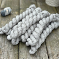 Grey mini skeins of yarn