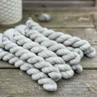 Grey mini skeins of yarn