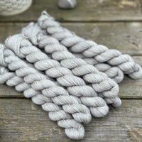 Grey mini skeins of yarn