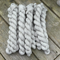 Grey mini skeins of yarn