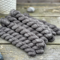 Dark grey mini skeins of yarn