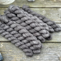Dark grey mini skeins of yarn