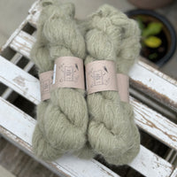 Five skeins of fluffy green yarn