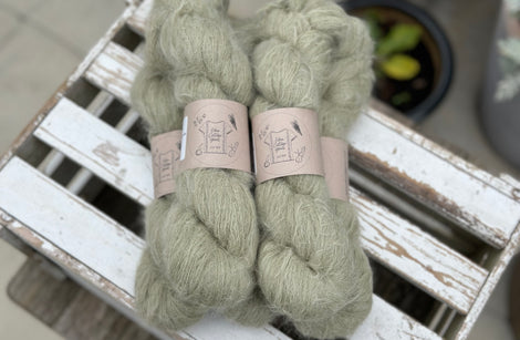 Five skeins of fluffy green yarn