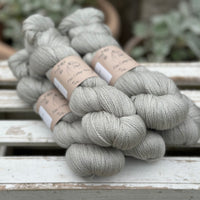 Five skeins of grey yarn