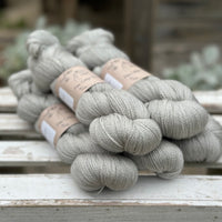 Five skeins of grey yarn