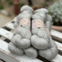 Five skeins of grey yarn