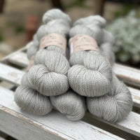 Five skeins of grey yarn