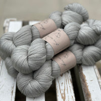 Five skeins of grey yarn