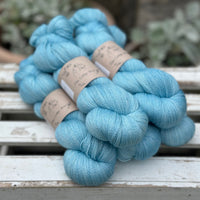 Five skeins of bright blue yarn