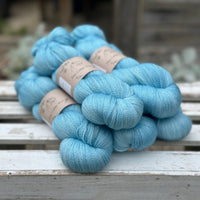 Five skeins of bright blue yarn