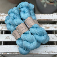 Five skeins of bright blue yarn