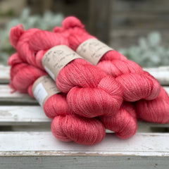 Five skeins of bright pink yarn