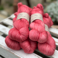 Five skeins of bright pink yarn