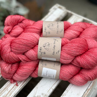 Five skeins of bright pink yarn