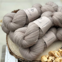 Five skeins of light brown yarn