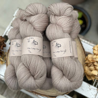 Five skeins of light brown yarn