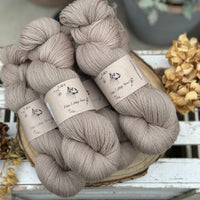 Five skeins of light brown yarn