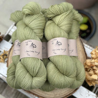 Five skeins of green laceweight yarn