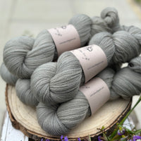 Five skeins of grey laceweight yarn