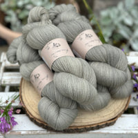 Five skeins of grey laceweight yarn