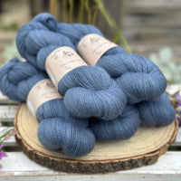 Five skeins of blue laceweight yarn