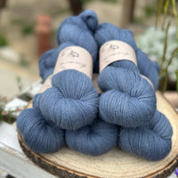 Five skeins of blue laceweight yarn