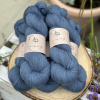 Five skeins of blue laceweight yarn