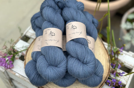 Five skeins of blue laceweight yarn