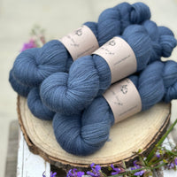 Five skeins of blue laceweight yarn