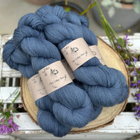 Five skeins of blue laceweight yarn