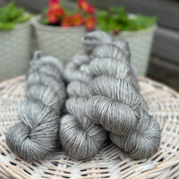 Four skeins of grey yarn