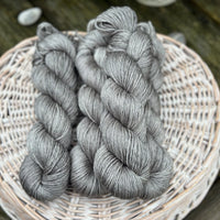 Four skeins of grey yarn