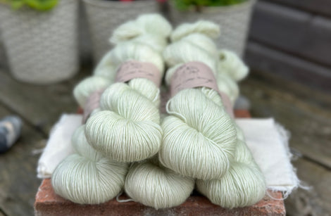 Five skeins of pale green yarn