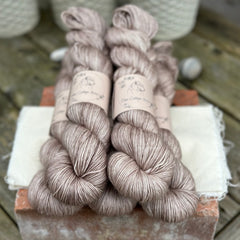 Five skeins of pale brown yarn