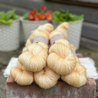 Five skeins of pale yellow yarn