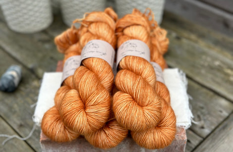 Five skeins of orange yarn