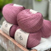 Balls of purple yarn
