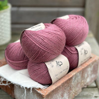 Balls of purple yarn