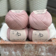 Balls of pale pink yarn