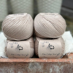 Balls of beige yarn