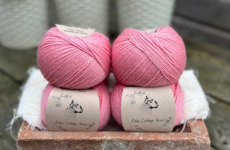 Balls of bright pink yarn